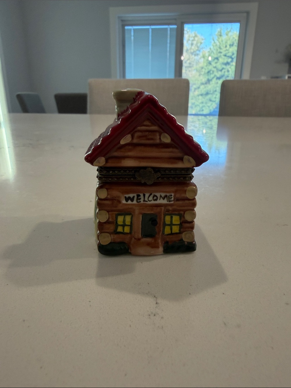 Log cabin hinged trinket box with red roof and welcome sign